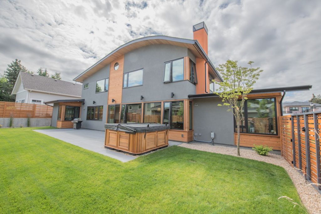 Photo of Architecturally curved roofline with wood soffit.
