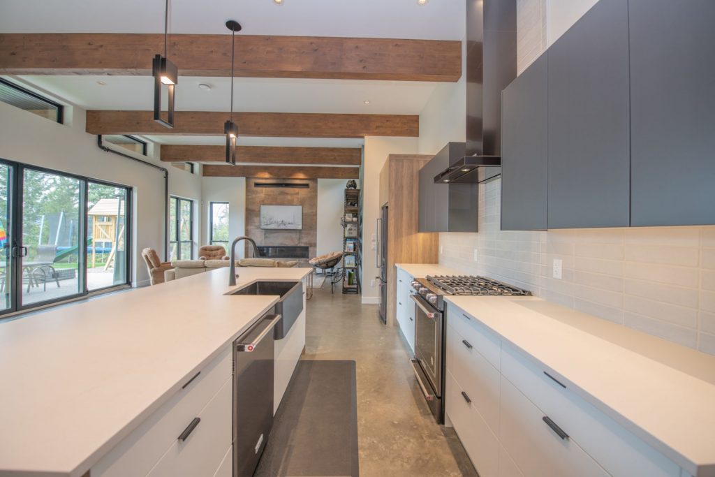 Photo of kitchen with multiple textures and colors enhance this functional kitchen.