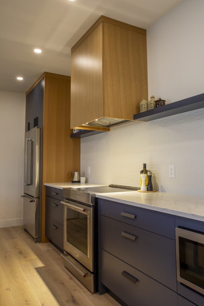 Kitchen with modern cabinetry, built-in appliances, and a sleek design.