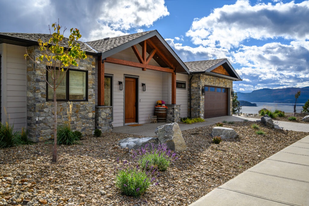 Adventure Bay custom home with timber accents and lake views.